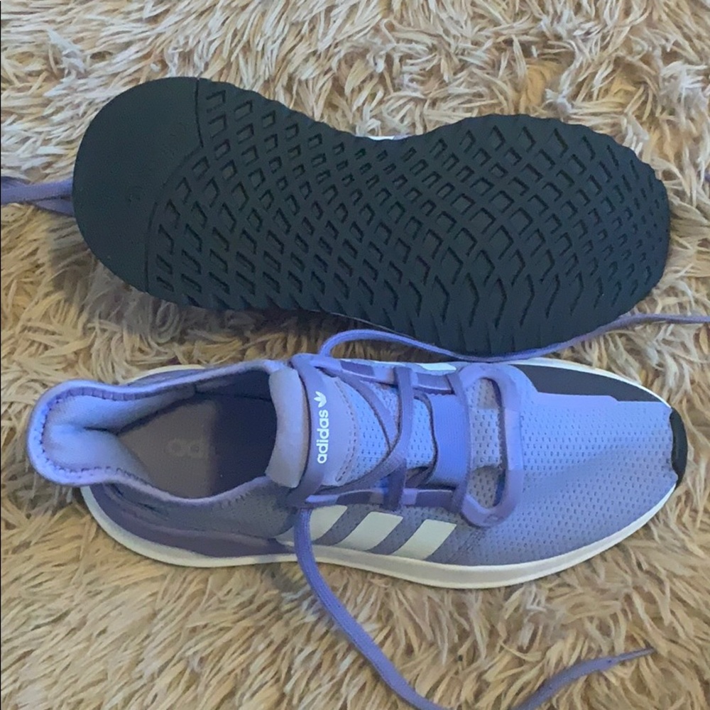 Adidas women’s tennis shoe.